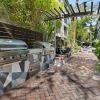 outdoor grilling area on a brick patio